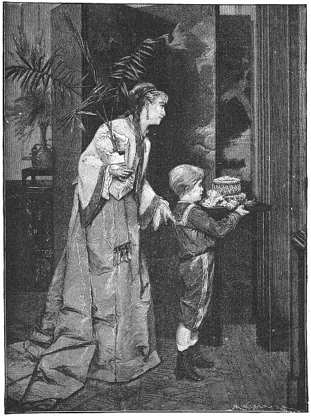 Little boy with tray of small gifts with his mother behind h im