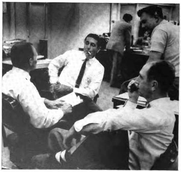 Men sititng togther smoking and talking