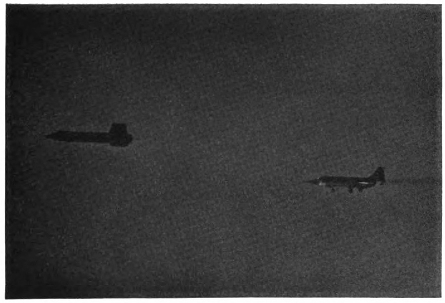 Two planes in the air, one following the other closely