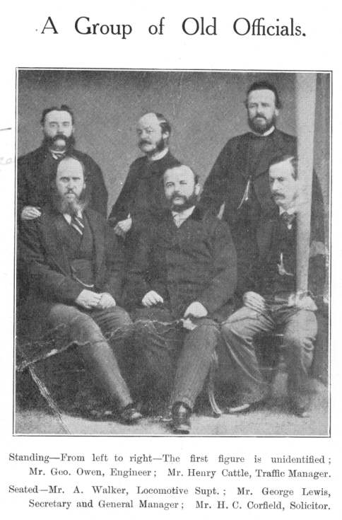 A Group of Old Officials.  Standing&mdash;From left to
right&mdash;The first figure is unidentified; Mr. Geo. Owen, Engineer; Mr.
Henry Cattle, Traffic Manager.  Seated&mdash;Mr. A. Walker, Locomotive
Supt.; Mr. George Lewis, Secretary and General Manager; Mr. H. C. Corfield,
Solicitor