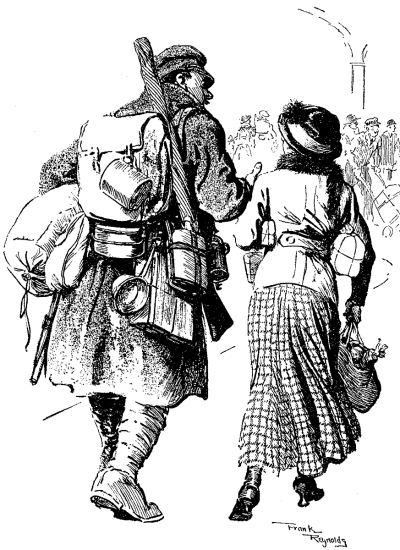 Heavily laden British soldier walking
with a small woman with packages.