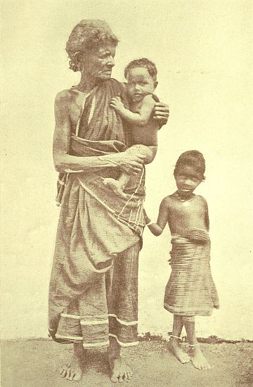 An ancient Pariah, but the baby in her arms is a son of the Caste of Palmyra Climbers. Both faces&mdash;the old crone's and the baby boy's&mdash;are very typical. The baby is a "Christian," I should explain, and his parents are true Christians, otherwise the Pariah woman would not have been allowed to touch him.