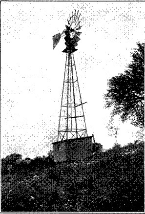 Fig. 43.&mdash;Windmill and water tank.