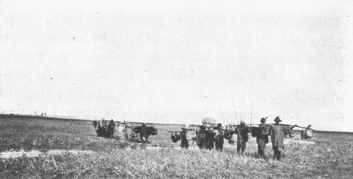 Eld. Steigerwald and Mr. Doner with Carriers
on Their Trip North of Macha.