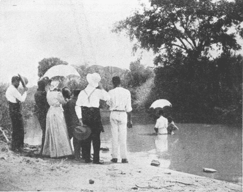 First Baptismal Scene at Macha. Native
Congregation Not Visible.