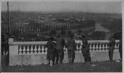 SO THIS IS PARIS
A. E. F. Boys, guests of our A. R. C. in its great hospital at St. Cloud, look down about the "Queen City of
the World"