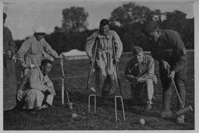 "NEVER SAY DIE"
Sorely wounded, our boys at the great A. R. C. field hospital in the Auteuil race track outside
of Paris, kept an active interest in games and sports

