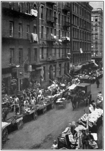 THE GHETTO OF THE NEW WORLD.

East of the Bowery in New York City is the heart of the largest Jewish
community in the world. Sidewalks, street signs, language, all indicate
the process of development.