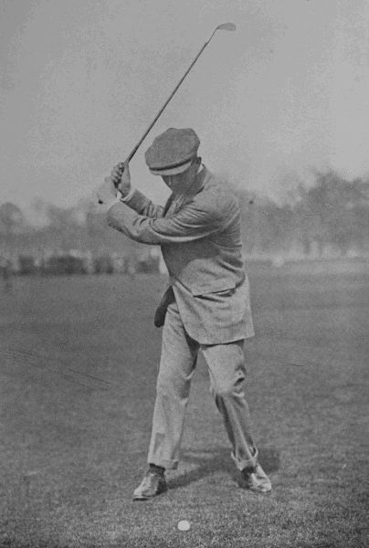 PLATE XIV.

J. SHERLOCK

Top of swing in iron-shot. Note the position of the ball, and the
upright swing of the club.