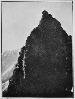 A party ascending the Aiguilles Rouges (Arolla). The
people can be seen on the sky-line to the left, at the top of the white
streak. By Mr. Leonard Rawlence.