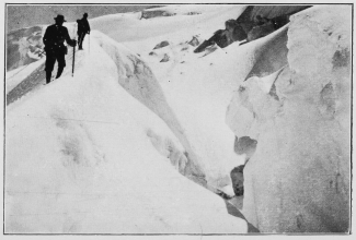 A great crevasse in the upper snow fields.

To face p. 137.