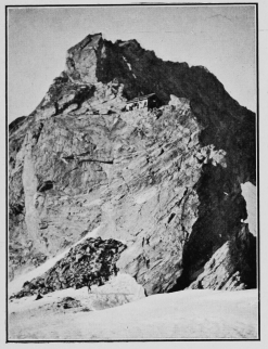 The hut on the Col de Bertol, where climbers now often
sleep for the ascent of the Dent Blanche. By Mr. Leonard Rawlence.