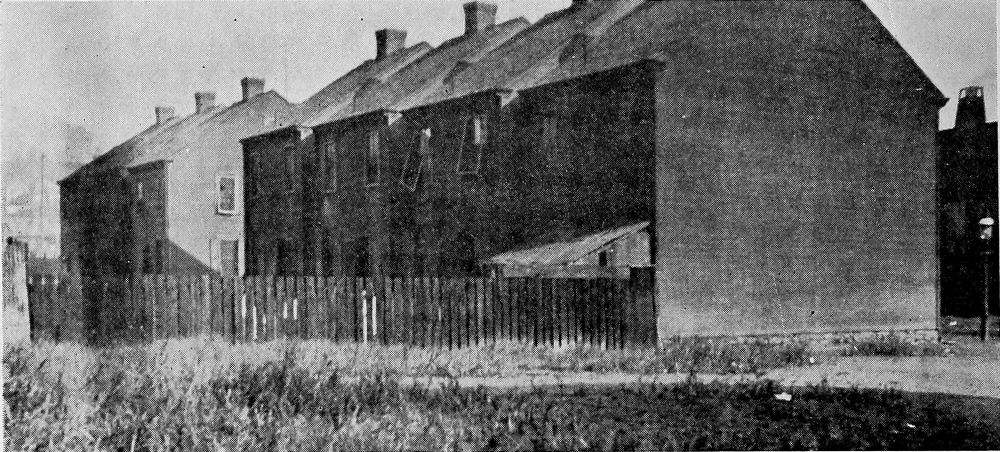 Wooden Shacks Used as Living and Sleeping Quarters in a
Railroad Camp.