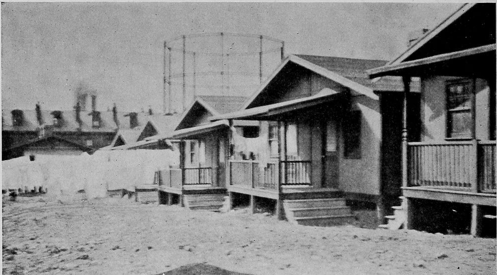 A Row of Model Houses Originally Built by a Steel
Company for its Colored Workers, but used by Foreign Laborers at
Present Because of the Protest of the People in the Neighborhood.
